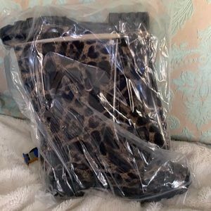 Size 7 animal print plastic rain boots by Corkys.